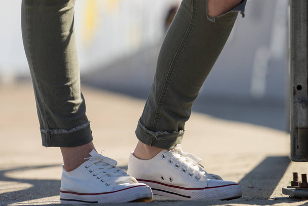 Woman wearing white sneakers - Foto, Bild