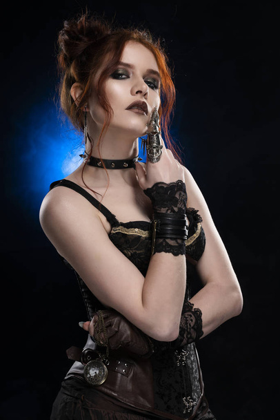 A beautiful thoughtful redhead cosplay girl wearing a Victorian- - Fotoğraf, Görsel