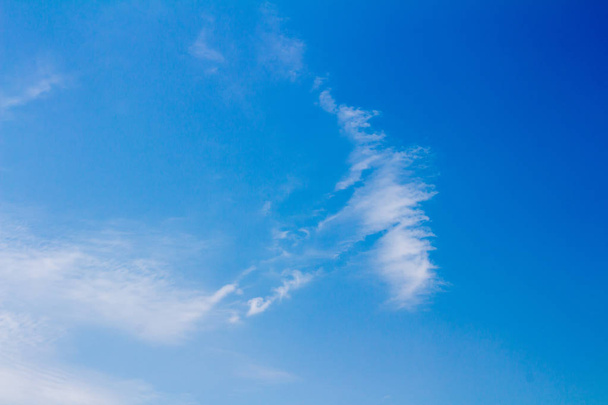 Blue sky with clouds background - 写真・画像