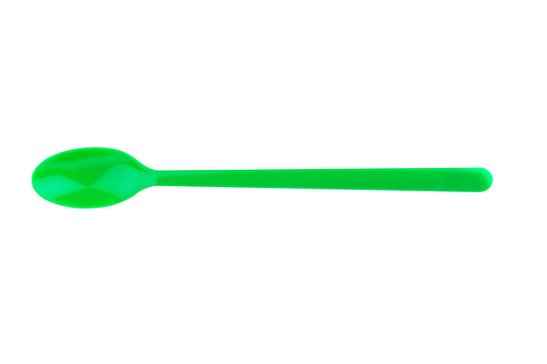 colher verde de plástico isolado no fundo branco
 - Foto, Imagem