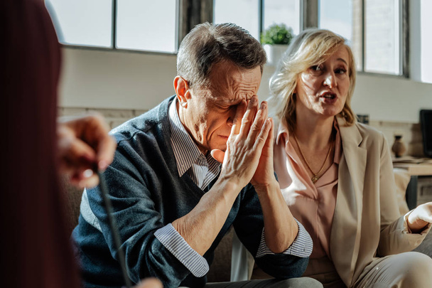Distressed old man being depressed with situation in his family - Photo, Image