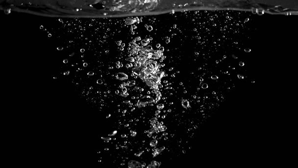 Blurry images of soda bubbles splashing in black background - Foto, Imagem