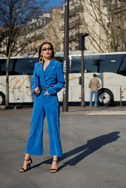 A trendy woman in fashionable outfit is pictured on the street during the Paris Fashion Week Fall/Winter 2019/2020 in Paris, France. - Фото, зображення