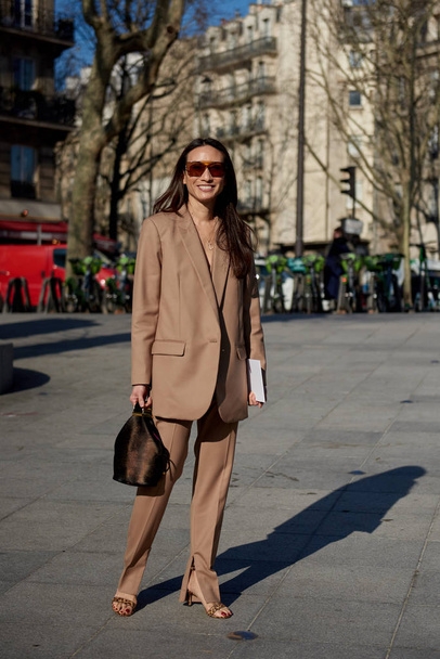A trendy woman in fashionable outfit is pictured on the street during the Paris Fashion Week Fall/Winter 2019/2020 in Paris, France. - Fotoğraf, Görsel