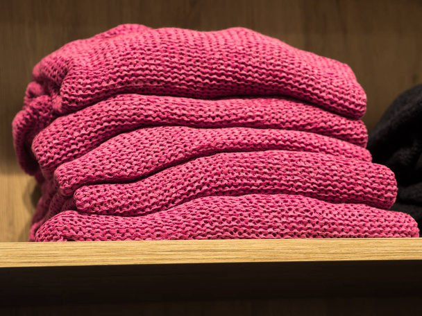 Pile of pink sweaters in a fashion store - Photo, Image