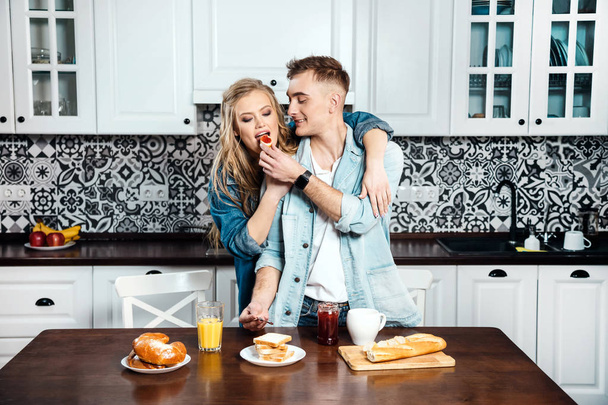 Couple Eating at the Kitchen - Фото, зображення