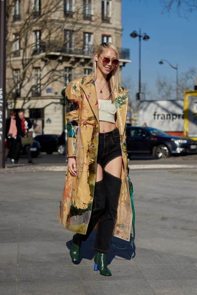 A trendy woman in fashionable outfit is pictured on the street during the Paris Fashion Week Fall/Winter 2019/2020 in Paris, France. - Fotó, kép