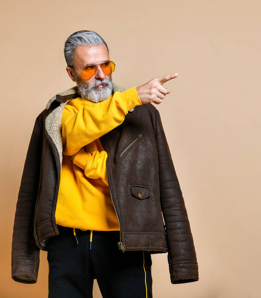 senior stylish rich man with a beard and mustache in a leather coat - Φωτογραφία, εικόνα