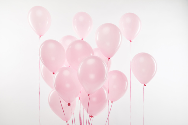 background with bundle of decorative pink air balloons on white - Фото, изображение