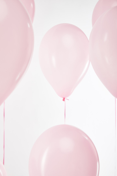 background with festive floating pink air balloons isolated on white - Фото, зображення