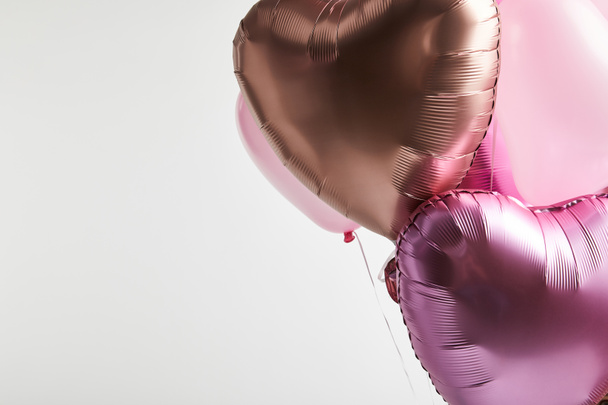 heart-shaped pink and golden balloons isolated on white with copy space - Valokuva, kuva