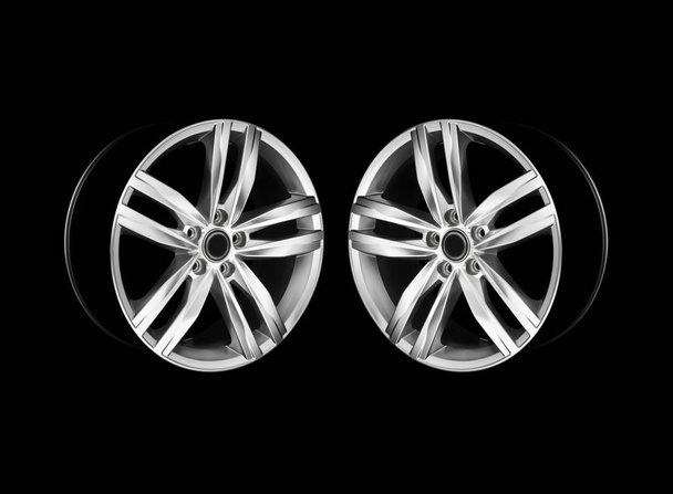 Two car wheel rims in a dramatic light  - Photo, Image