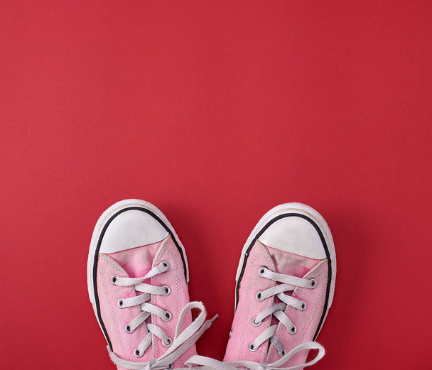 pair of pink old textile sneakers  - Photo, Image