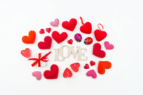 Valentine's Day holiday. The inscription, heart, candles, decoration top view. - Foto, imagen