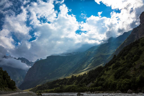 Mountains of the North Caucasus, mountain tops in clouds. Wild nature - Valokuva, kuva