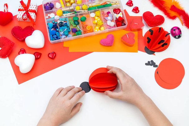 Ladybug made of paper craft. Red love symbol. Children's hand-made - Photo, Image