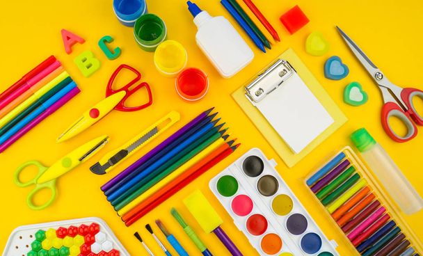 Stationery yellow background. Education. Training material for learning and creativity. - Photo, image