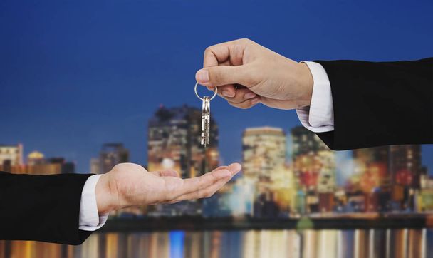 Real estate business, residential rental and investment. Businessman handover keys - Photo, Image