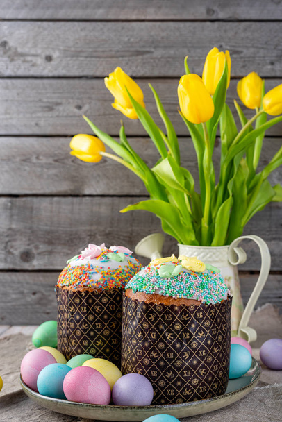 Easter cake, painted eggs on a wooden background. - Photo, Image