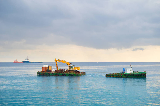 Industrial tug carrying boat sea - Фото, изображение