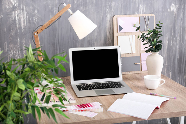 Stylish workplace with modern computer near grey wall - Photo, Image
