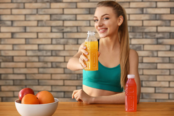 Young woman with healthy juice at home - Photo, Image