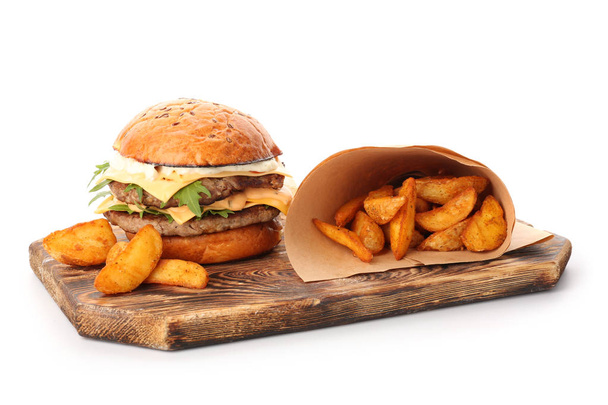 Tasty burger and fried potato on white background - Fotó, kép