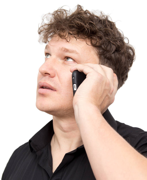 man with phone on a white background - Фото, зображення