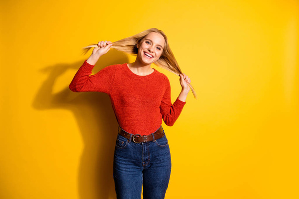 Portrait of her she nice-looking cute attractive winsome lovable fascinating lovely adorable cheerful cheery girl making ponytails isolated over bright vivid shine orange background - Foto, imagen