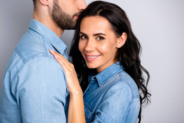 My love life. Cropped close up portrait of married inspired affectionate people relaxed enjoying company receiving warm embraces wearing casual denim outfit isolated over ashy-gray background - Photo, image