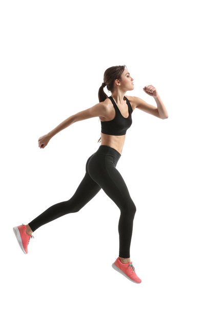 Sporty female runner on white background - 写真・画像