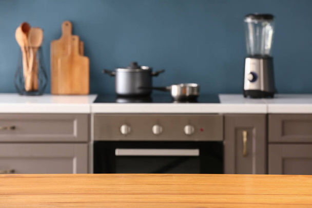 Wooden table in modern kitchen - Фото, зображення