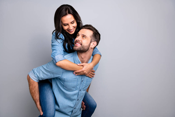 Close up photo funky cheer crazy she her he him his couple in love lady guy best friends piggyback ride buddies fellow wear casual jeans denim shirts outfit clothes isolated light grey background - Fotografie, Obrázek