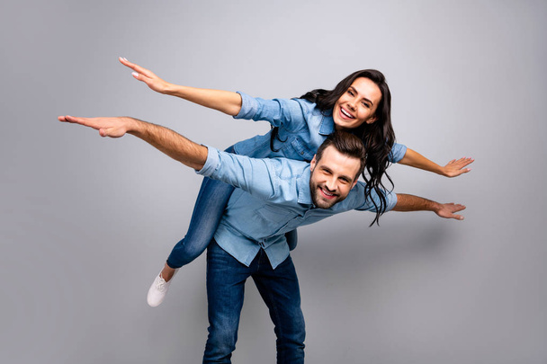 Close up photo cheer funky she her he him his lady guy amazed hands arms like wings piggy-back ride walk highway adventures wear casual jeans denim shirts outfit clothes isolated light grey background - Фото, зображення