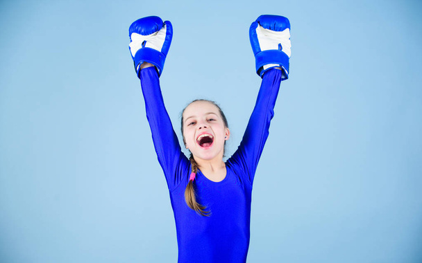 Full of energy. punching knockout. Childhood activity. Fitness diet. energy health. Sport success. sportswear fashion. Happy child sportsman in boxing gloves. workout of small girl boxer - Φωτογραφία, εικόνα