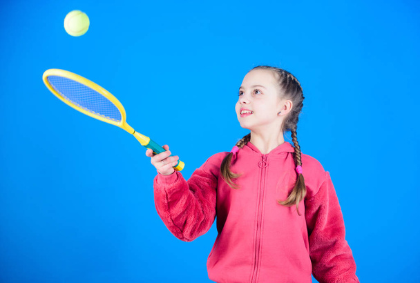 Tennis player with racket and ball. Little teen girl. Fitness diet brings health and energy. Happy child teen girl play tennis. Sport game success. Gym workout of teen girl. teen girl practice skills - Foto, afbeelding