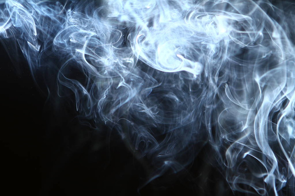 amazing abstract glowing bright smoke on the heavy black background. - Foto, Imagem