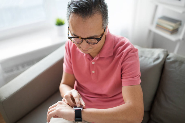 close up of man with smart watch - 写真・画像