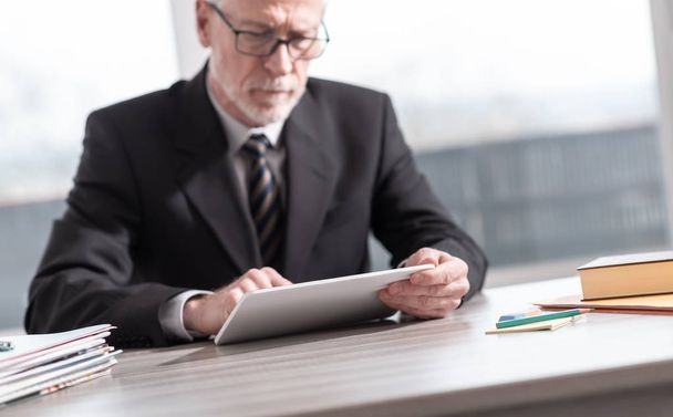 Senior businessman using a digital tablet - Photo, image