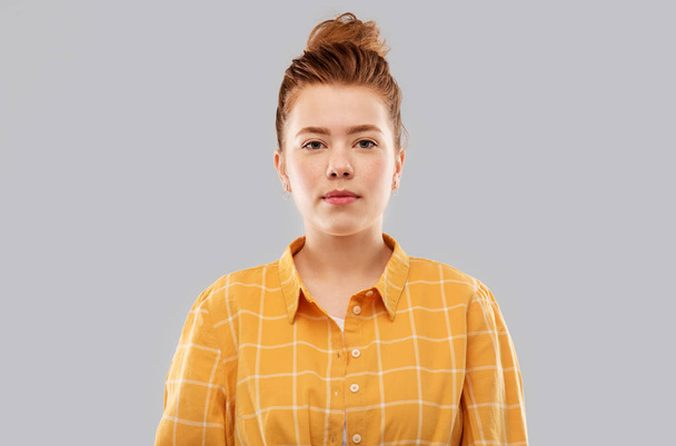 red haired teenage girl in checkered shirt - Fotó, kép