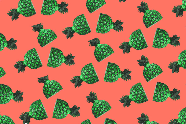 Colorful fruit pattern of fresh pineapples on coral red background. From top view - Fotó, kép