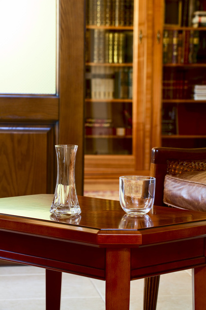 Vase and a glass on the coffee table - Zdjęcie, obraz