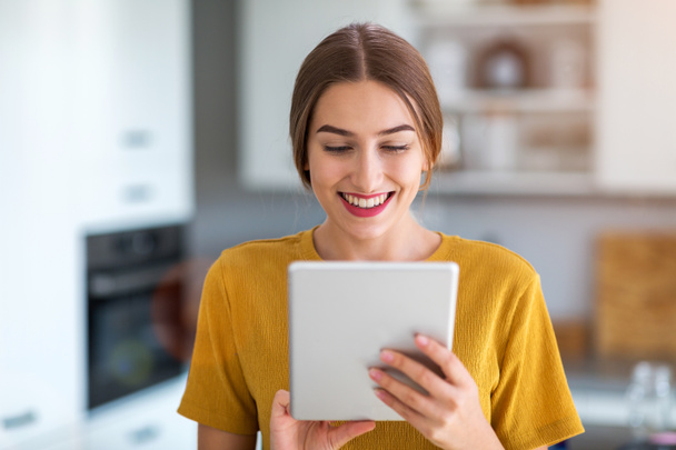 Young woman using digital tablet at home - Foto, Imagem