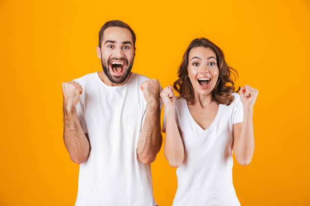 Image of ecstatic people man and woman in basic clothing laughin - Foto, Bild