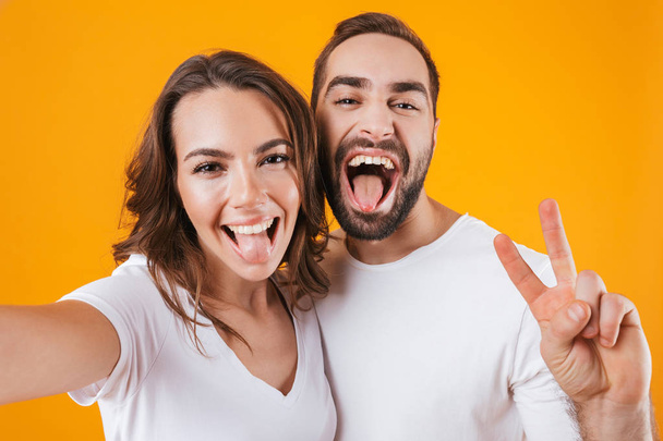 Portrait of two cheerful people man and woman smiling while taki - Fotoğraf, Görsel