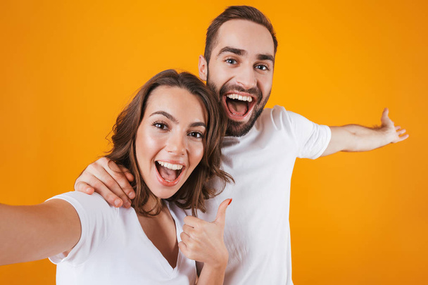 Portrait of two happy people man and woman smiling while taking  - Foto, imagen