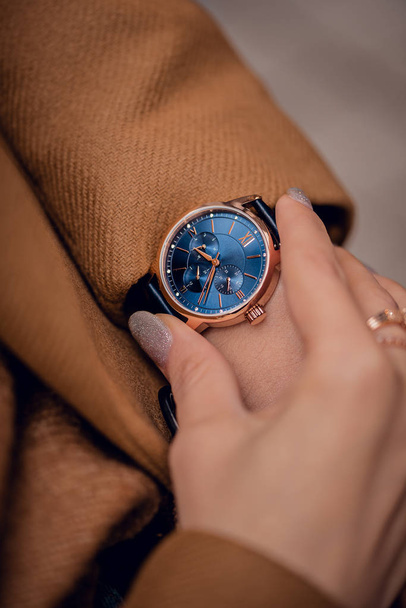 Beautiful blue watch on woman hand - Foto, Imagen