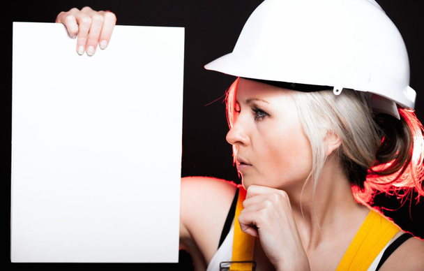 Young architect woman construction worker, empty banner - Foto, Bild