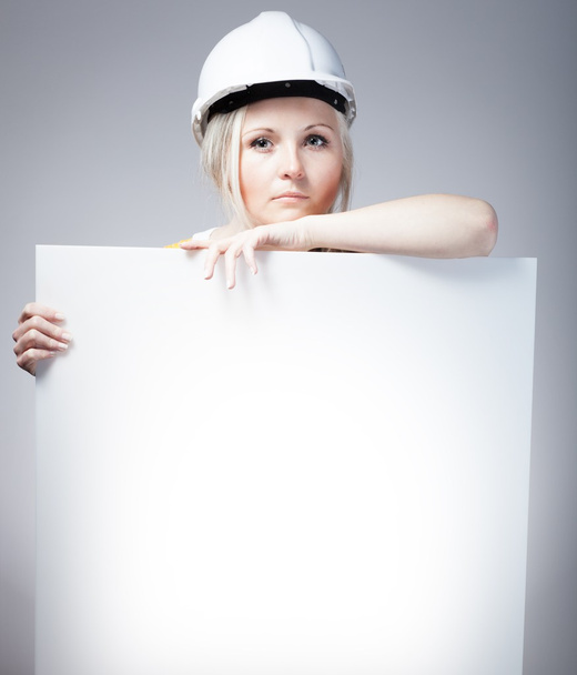 Young builder craftswoman construction worker, empty poster - Photo, Image