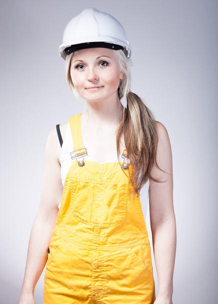 Young woman as a construction worker - Foto, Imagen